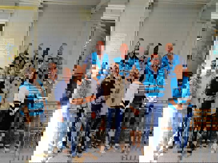 Ambassador Sammelin together with the Swedish delegation, Frontex-staff and deputy head of camp Dimitris Vafeas.